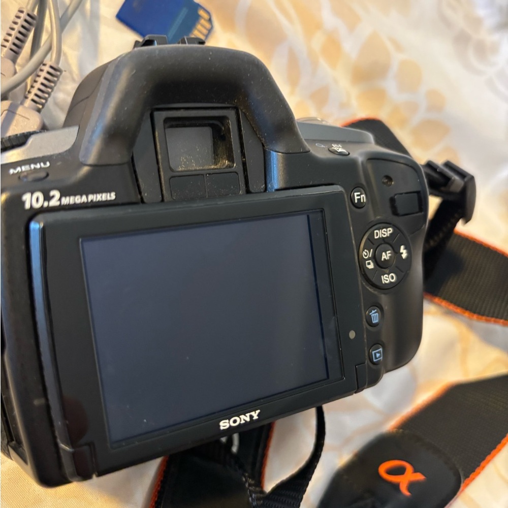 Sony Black Digital Camera with Orange Accents